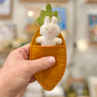 Felt bunny in a carrot bed