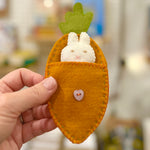 Felt bunny in a carrot bed